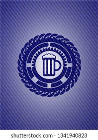 beer jar icon inside badge with denim texture