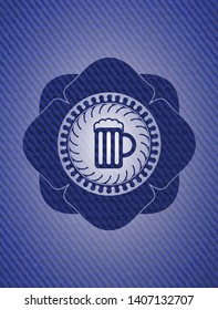 beer jar icon inside badge with denim background
