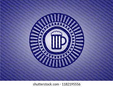 beer jar icon inside emblem with jean background