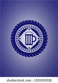 beer jar icon inside emblem with denim texture