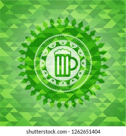 beer jar icon inside green mosaic emblem