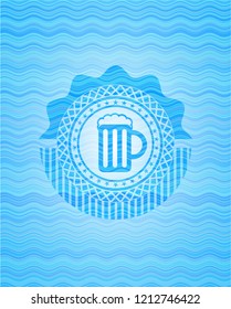 beer jar icon inside light blue water wave emblem background.