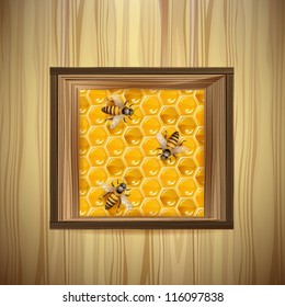 Bees and honeycombs over wood background