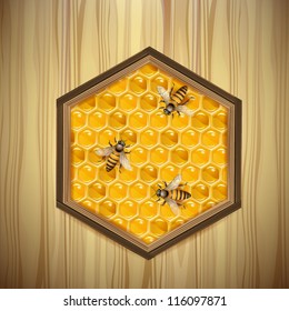Bees and honeycombs over wood background