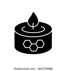 Beeswax candle black glyph icon. Natural bee product. DIY apiculture, beekeeping business silhouette symbol on white space. Handmade decorative candle from organic wax vector isolated illustration