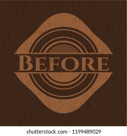 Before badge with wooden background