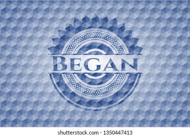 Began blue badge with geometric background.
