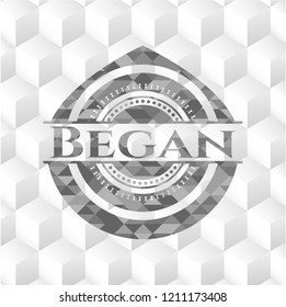 Began grey badge with geometric cube white background