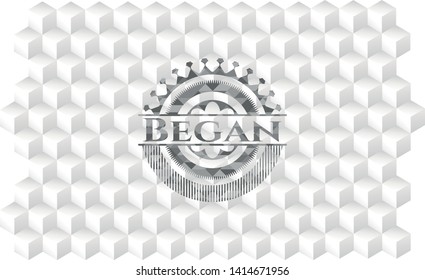 Began realistic grey emblem with cube white background