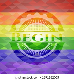 Empieza el emblema sobre el fondo de mosaico con los colores de la bandera LGBT