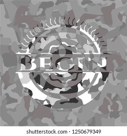 Begin on grey camo texture