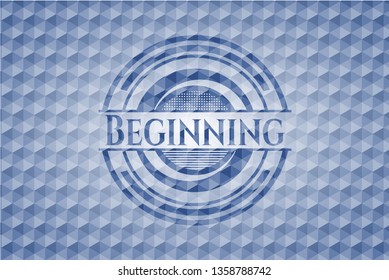 Beginning blue emblem or badge with abstract geometric pattern background.