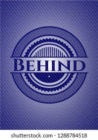 Behind badge with denim background