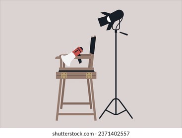 A behind-the-scenes scenario featuring movie equipment: a softbox lighting, a megaphone, and a director's chair