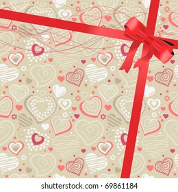 Beige background with hearts and silk red bow