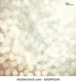 Beige bokeh background, light abstract blurred backdrop.