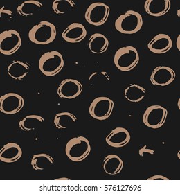 Beige circles on a black background. Abstract seamless grunge pattern