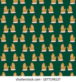 Beige colored doodle mittens print seamless xmas pattern. Knitted accessories on green background. Stock illustration. Vector design for textile, fabric, giftwrap, wallpapers.