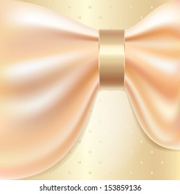 Beige fabric threaded through a gold ring. Layout for a wedding invitation
