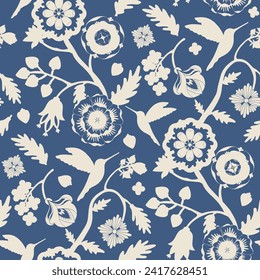 Beige flowers and hummingbirds silhouettes seamless pattern on blue background. Indian floral style pattern. For textile, wallpaper, packaging, DIY projects.