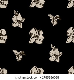 
Beige flowers on black background.