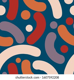 beige, orange, red and gray-purple smoothly curved abstract shapes with rounded edges and circles of different sizes are randomly located on the azure background and form a beautiful seamless pattern.