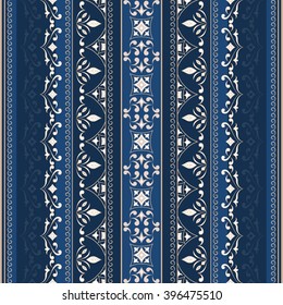 Beige seamless border on blue background. Ornate element for design. Ornamental lace pattern. Traditional floral beige decor.