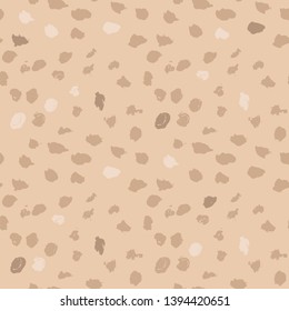 Beige seamless pattern with hand drawn dots on white background. Nude polka texture. Vector illustration.