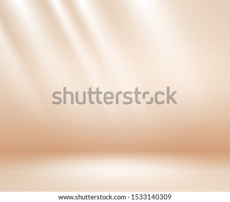 Beige studio background. Neutral background with soft rays. Warm soft light studio lighting. Photostudio soft box neutral lighting.