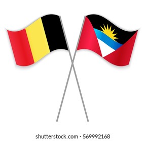 Belgian and Antiguan crossed flags. Belgium combined with Antigua and Barbuda isolated on white. Language learning, international business or travel concept.