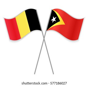Belgian and Timorese crossed flags. Belgium combined with East Timor isolated on white. Language learning, international business or travel concept.