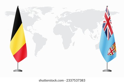 Belgium and Fiji flags for official meeting against background of world map.