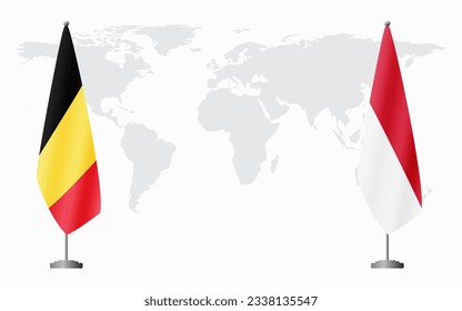 Belgium and Monaco flags for official meeting against background of world map.