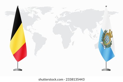 Belgium and San Marino flags for official meeting against background of world map.