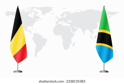 Belgium and Tanzania flags for official meeting against background of world map.
