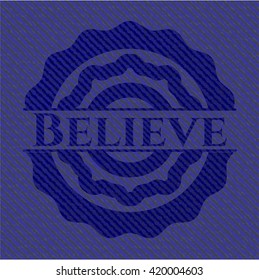 Believe badge with denim background