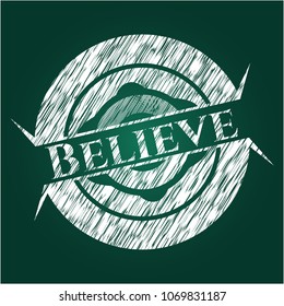  Believe chalk emblem written on a blackboard