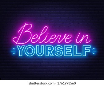 Believe in yourself neon inspirational quote on a brick wall.