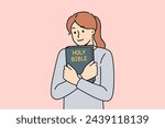 Believing woman embraces bible and feels enlightened after reading religious christian book with sermons or prayers. Holy bible in hands of teenage girl who wants to start study orthodoxy