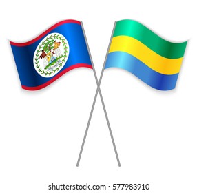 Belizean and Gabonese crossed flags. Belize combined with Gabon isolated on white. Language learning, international business or travel concept.