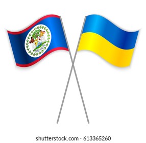Belizean and Ukrainian crossed flags. Belize combined with Ukraine isolated on white. Language learning, international business or travel concept.