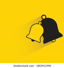 bells with shadow on yellow background