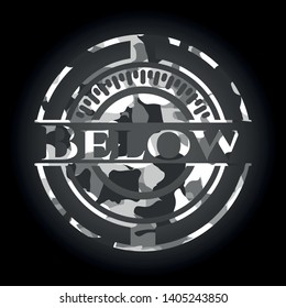 Below on grey camo texture