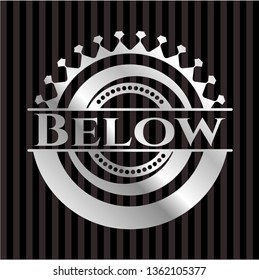 Below silvery badge or emblem
