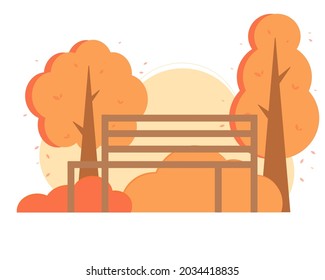 Bench in the autumn park surrounded by trees and bushes