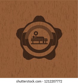 bench press icon inside badge with wooden background