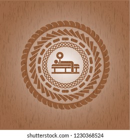 bench press icon inside badge with wood background