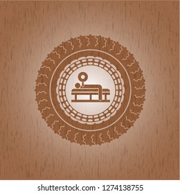 bench press icon inside badge with wood background