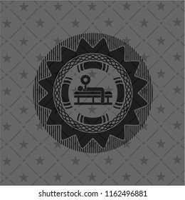 bench press icon inside black emblem