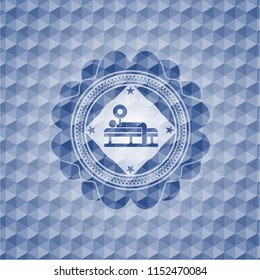 bench press icon inside blue emblem or badge with abstract geometric polygonal pattern background.